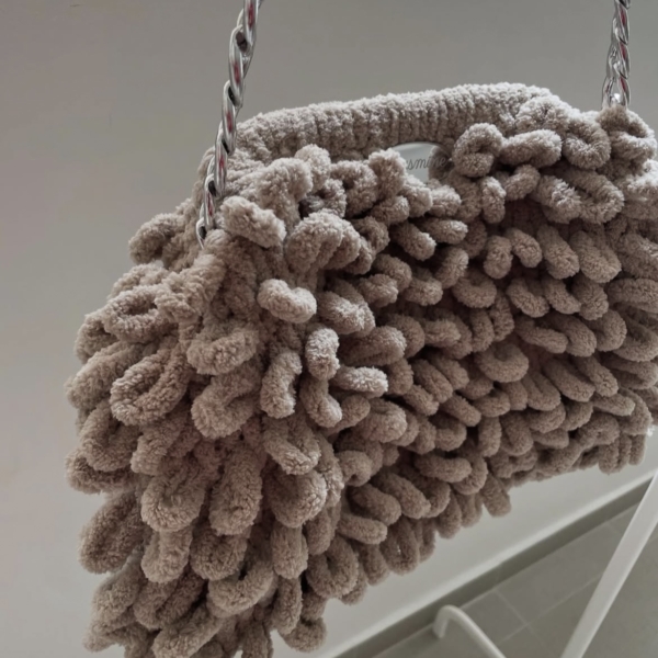 Beige puffy clutch