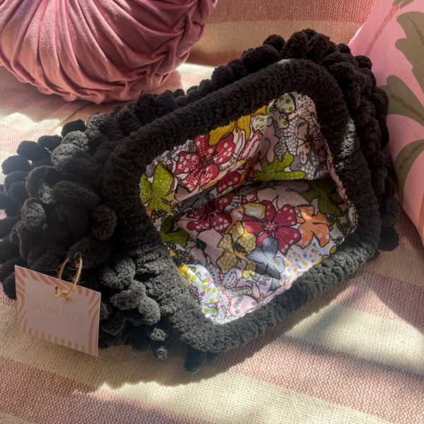 Black floral puffy clutch